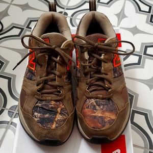 Men's new balance tennis shoes.